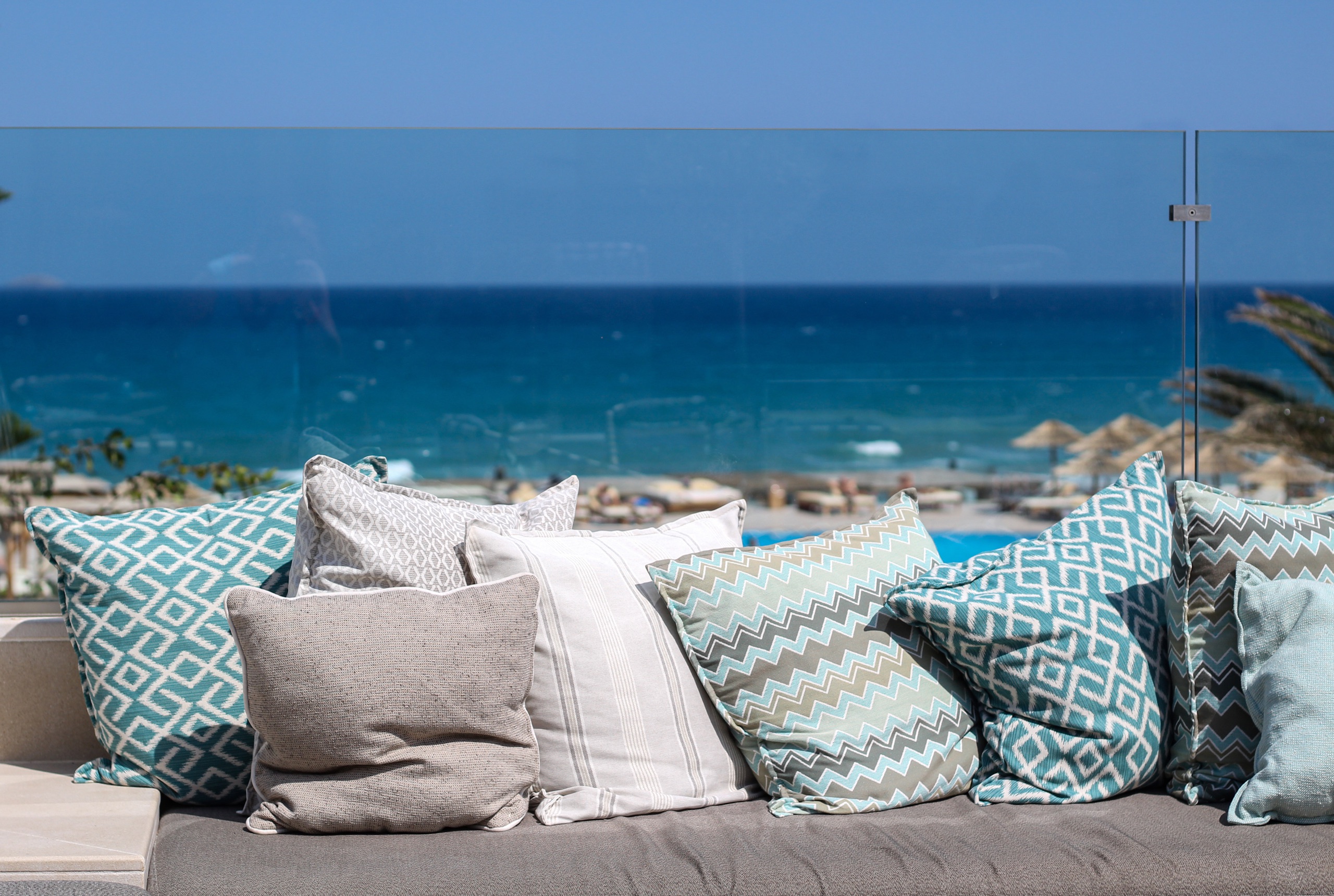 Cushioned outdoor seating overlooking the ocean