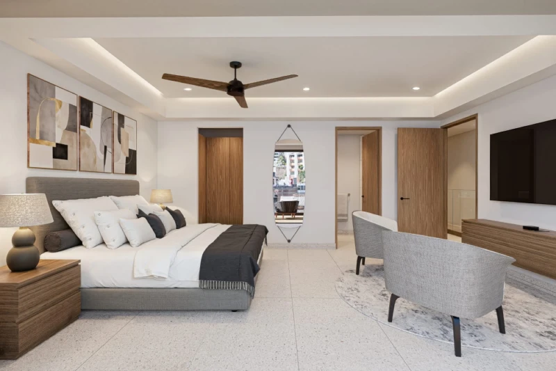 Illustrative rendering of the primary bedroom with sitting area and television