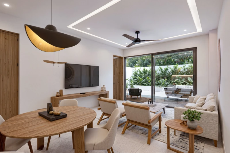 Illustrative rendering of the living and dining area opening onto a landscaped patio
